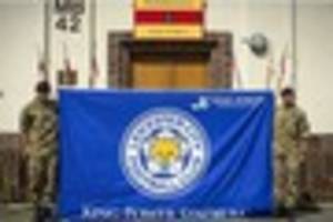 Leicester City fans fly the flag for the Blue Army in Afghanistan